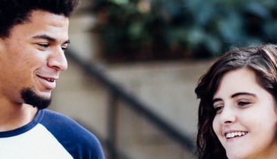 The same stock photo as before but cropped to fit only two of their faces