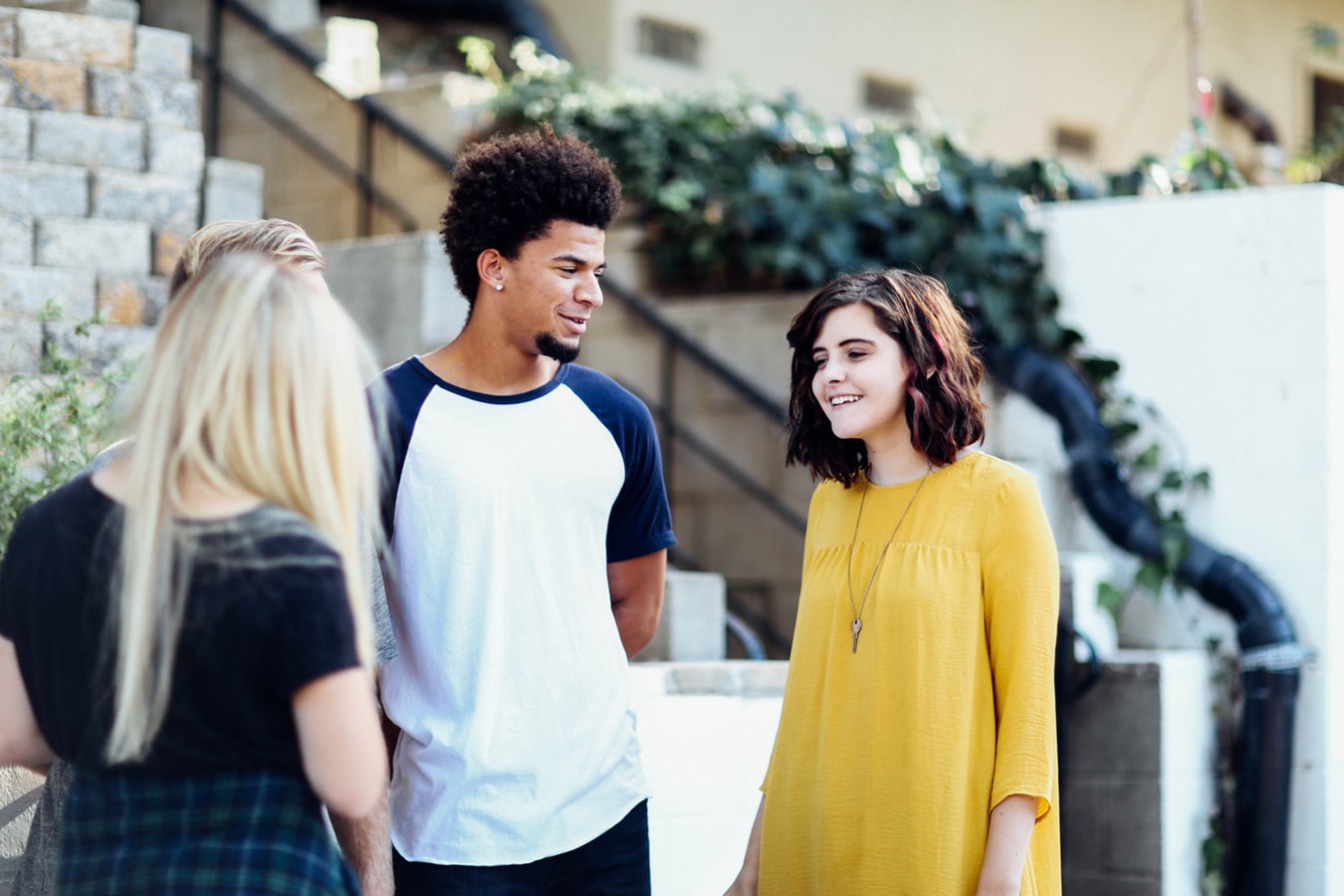A stock photo of a group of friends talking