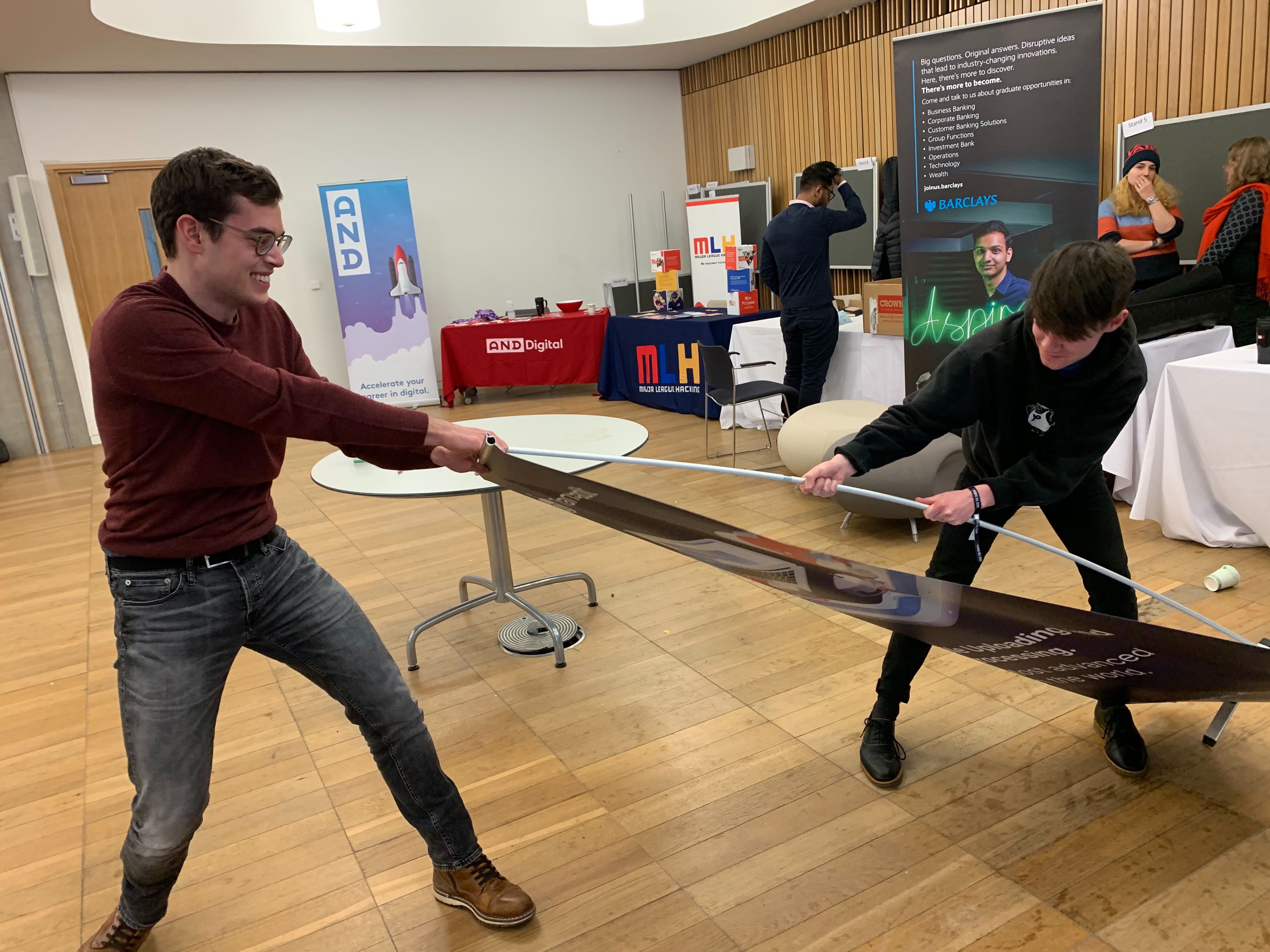 Marius and Charlie being bested by a banner