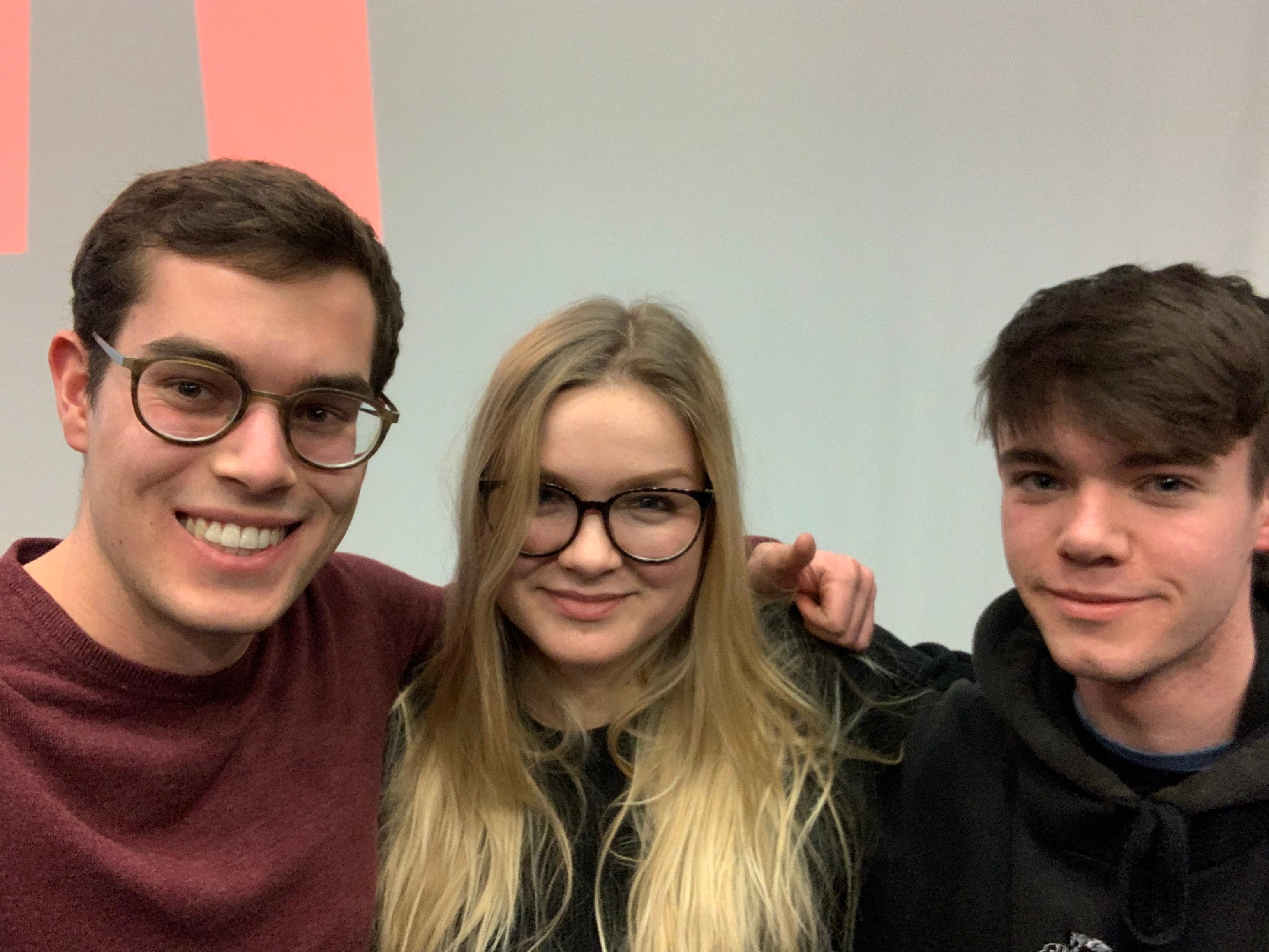 Marius, Elena and Charlie getting a selfie together.